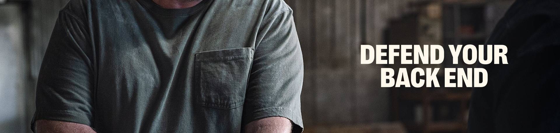 Headline: Defend Your Backend. Man wearing a t-shirt.