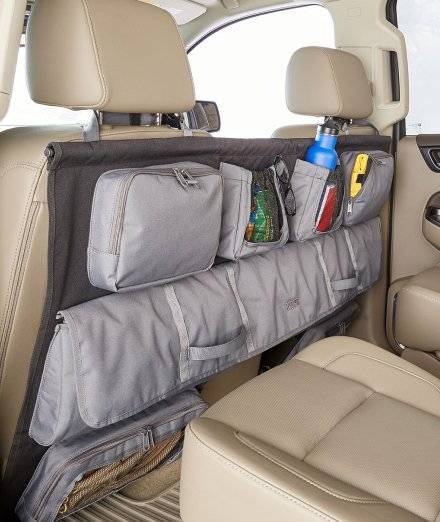 Organizer hanging on back of car seats.