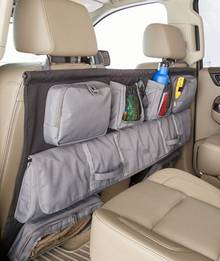 Organizer hanging on back of car seats.