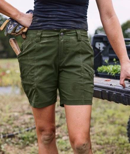 Woman wearing green shorts.