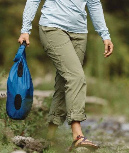 Woman wearing green hiking pants.