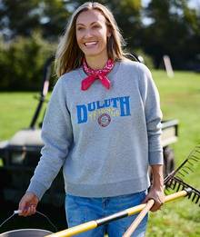 Woman wearing a Duluth Trading logo crewneck.