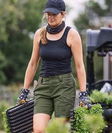 Woman wearing a black tank top.