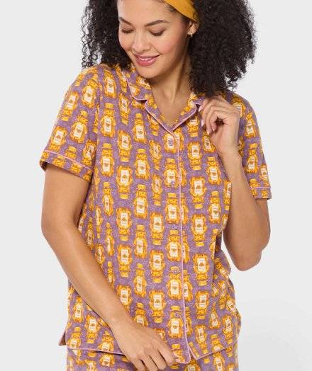 Woman wearing honey patterned pajamas.