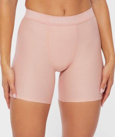 Woman wearing pink boxer brief underwear.