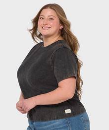 Woman wearing a black t-shirt.