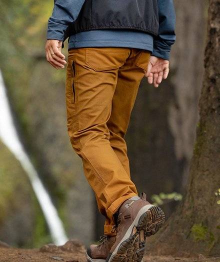 Man wearing orange hiking pants.