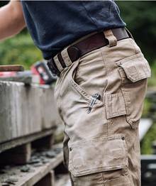 Man wearing khaki cargo work pants.