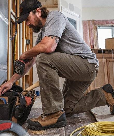 Man crouching in Fire Hose® Pants.