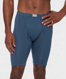 Man wearing long blue boxer briefs.
