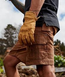 Man wearing tan cargo shorts.