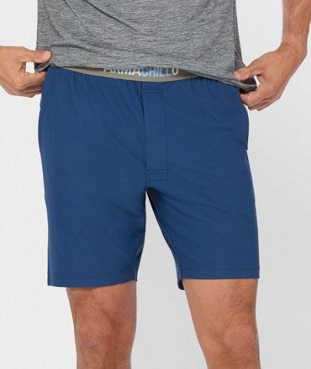 Man wearing pajama shorts.