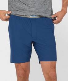 Man wearing pajama shorts.