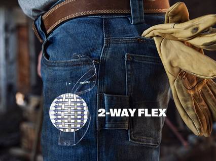 2-Way Flex. Man wearing jeans with work gloves in back pocket. DuluthFlex®