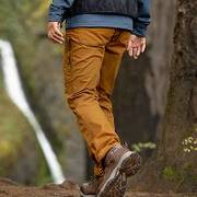 Man wearing orange hiking pants.