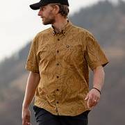 Man wearing brown short sleeve button-down shirt.