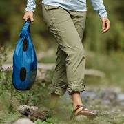 Woman wearing green hiking pants.