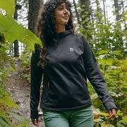 Woman wearing black hooded sweatshirt.