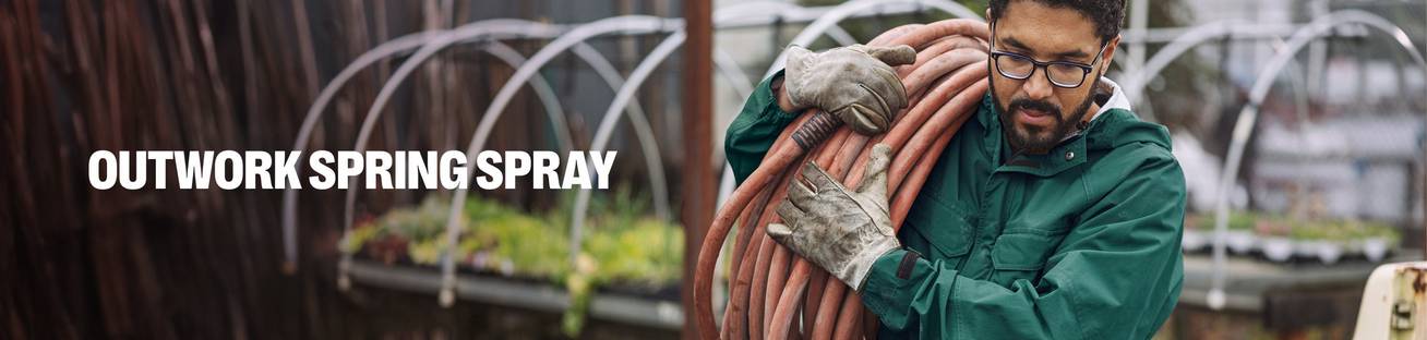 Headline: Outwork Spring Spray. A man carrying a hose