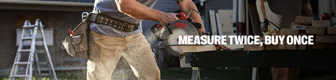 Headline: Measure Twice, Buy Once. A man wearing khaki work pants sawing wood