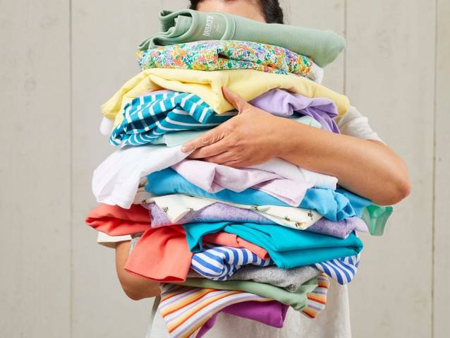 a pile of colorful women's shirts
