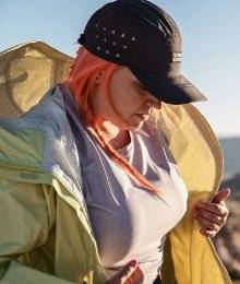 woman wearing all akhg; unzipping olympic coast jacket