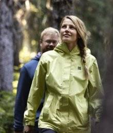man and woman hiking in washington; woman wearing olympic coast jacket