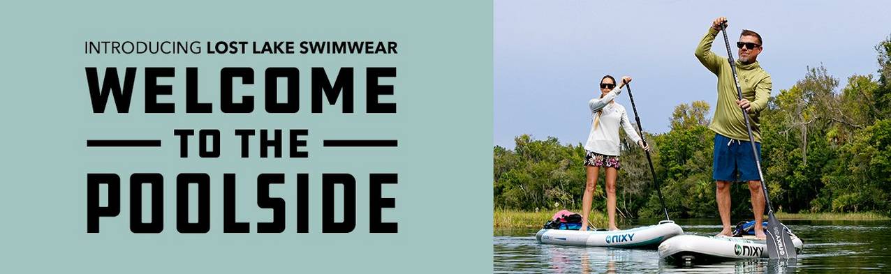 couple paddle boarding in florida wearing lost lake swim