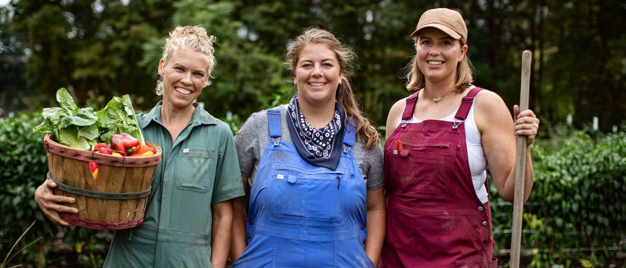nicole, jes and kara posing shoulder to shoulder on their farm