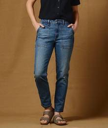 Woman wearing stovepipe jeans.