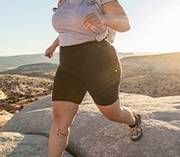 Woman wearing AKHG bottoms hiking in Utah
