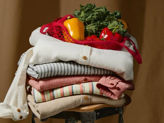 Women's hemp shirts folded & stacked.