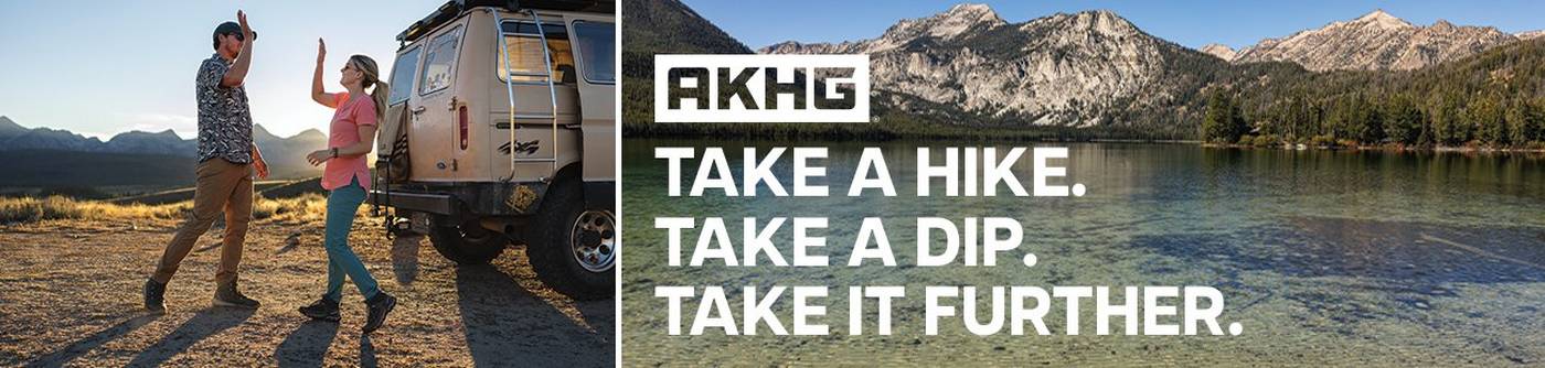 Headline: Take a hike. Take a dip. Take it further. Man and woman giving high five.