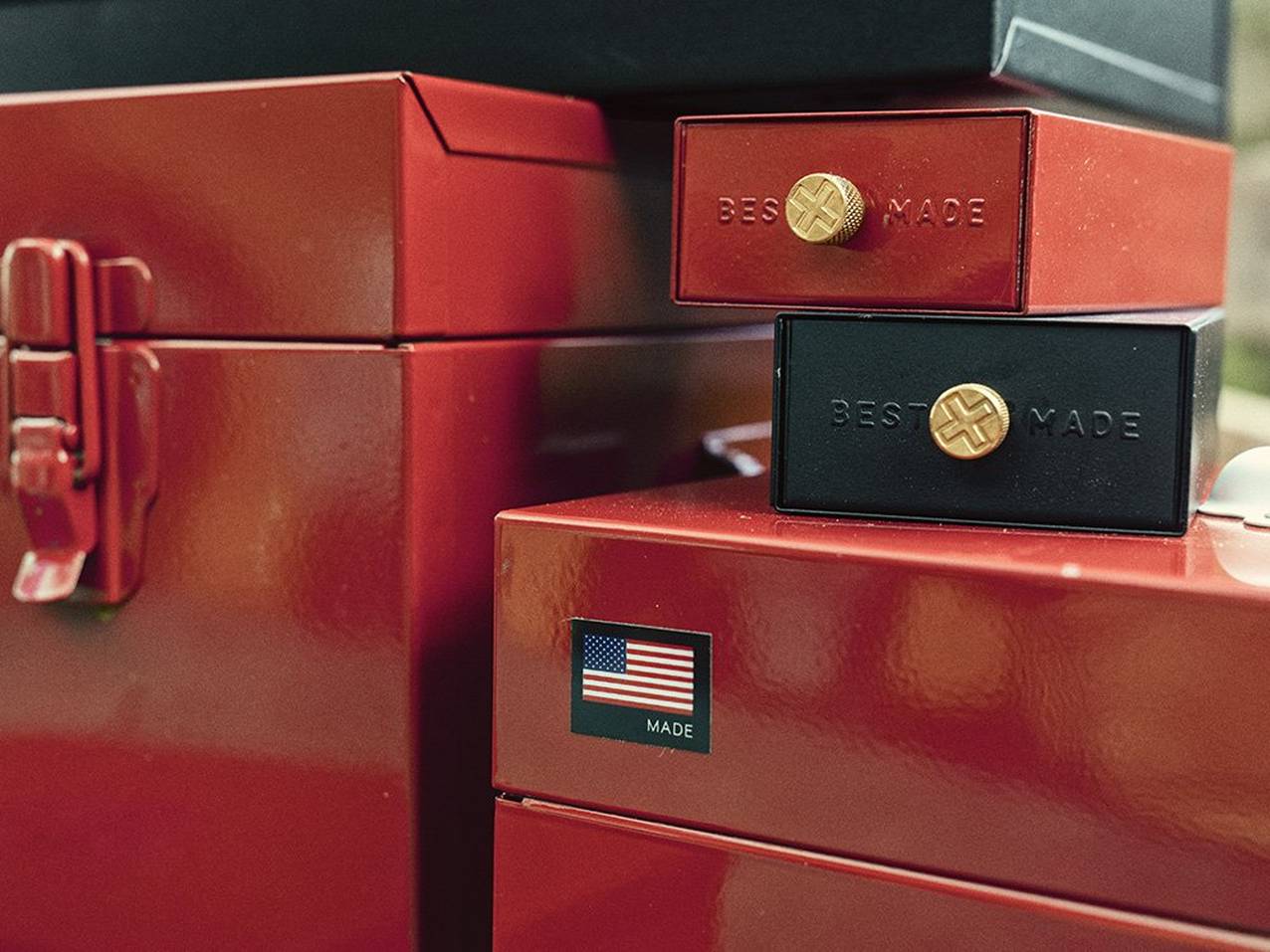 A close up of an American flag symbol on a red steel storage box.