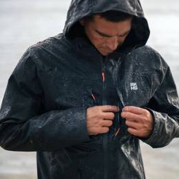 Man wearing black rain jacket.