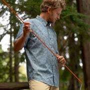 Man wearing blue short sleeve button-down.