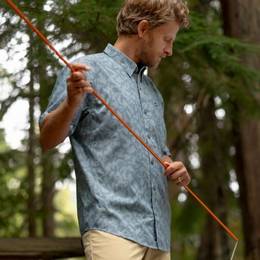 Man wearing blue short sleeve button-down.