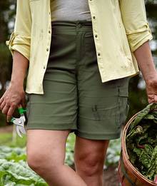 Woman wearing olive green shorts.