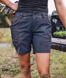 Woman wearing navy shorts.