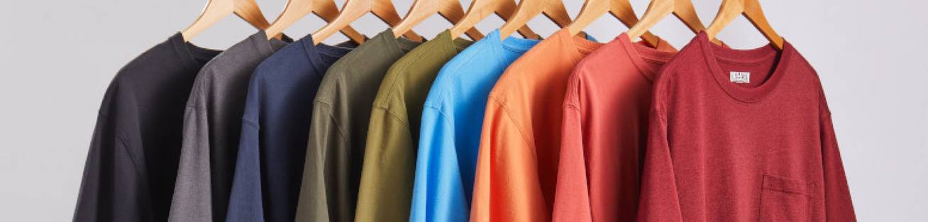 Men's shirts on wooden hangers