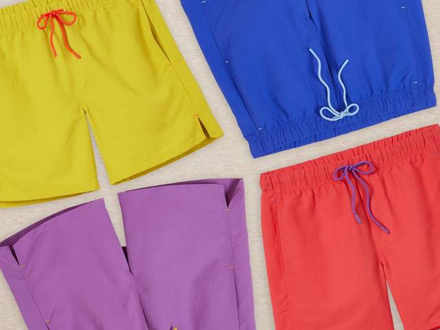 four pairs of grab shorts in amethyst, carnation red, grasshopper green, and sapphire