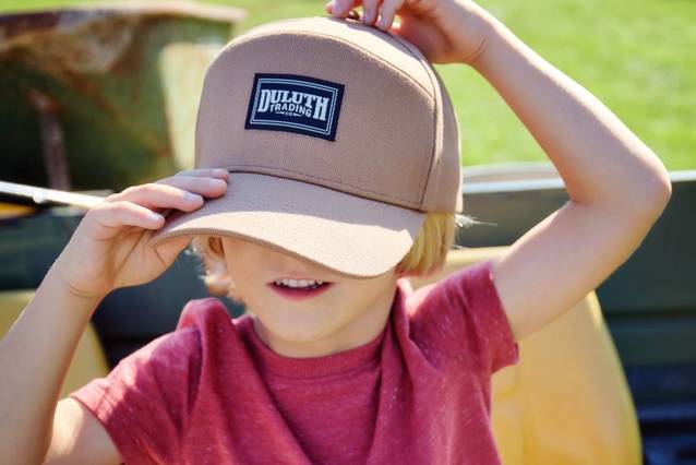 Child wearing Duluth Trading ball cap.