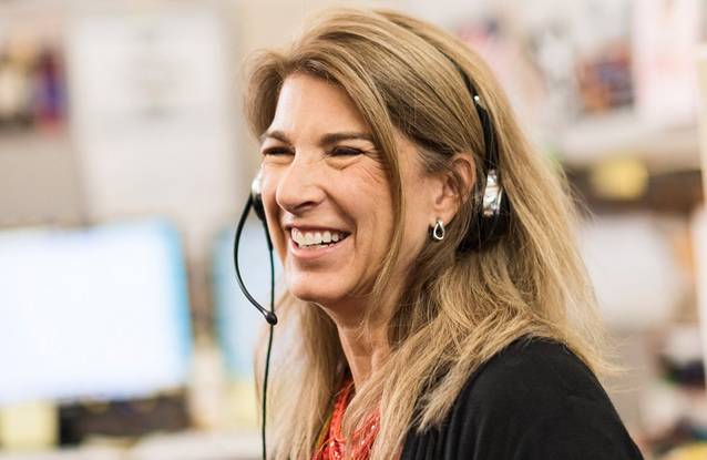 Smiling woman wearing a headset