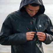 Man wearing black rain jacket