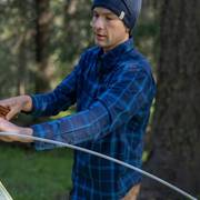 Man wearing blue flannel shirt