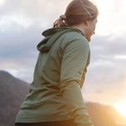 Woman wearing green hooded shirt