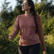 Woman wearing a red long sleeve shirt