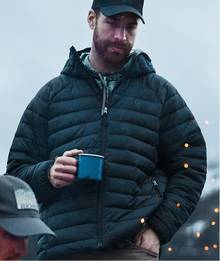 Man wearing navy puffer jacket.