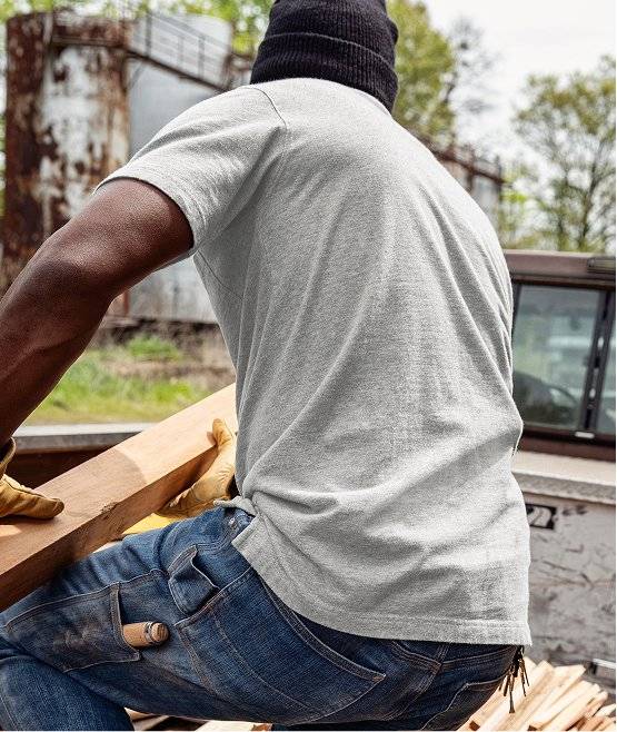Man wearing grey t-shirt.