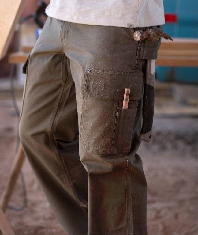 Man wearing grey work pants.
